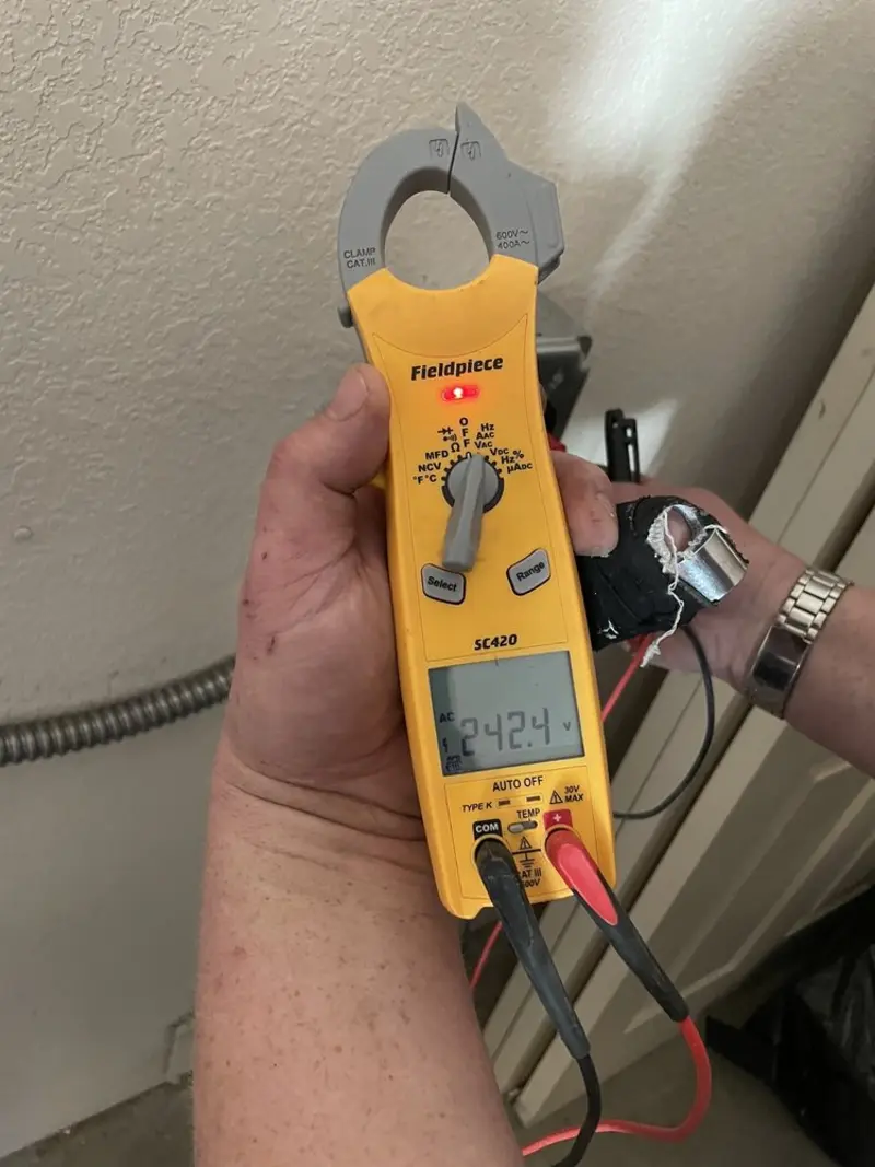 Voltage testing with clamp meter during Ceiling Fan Installation in Danville